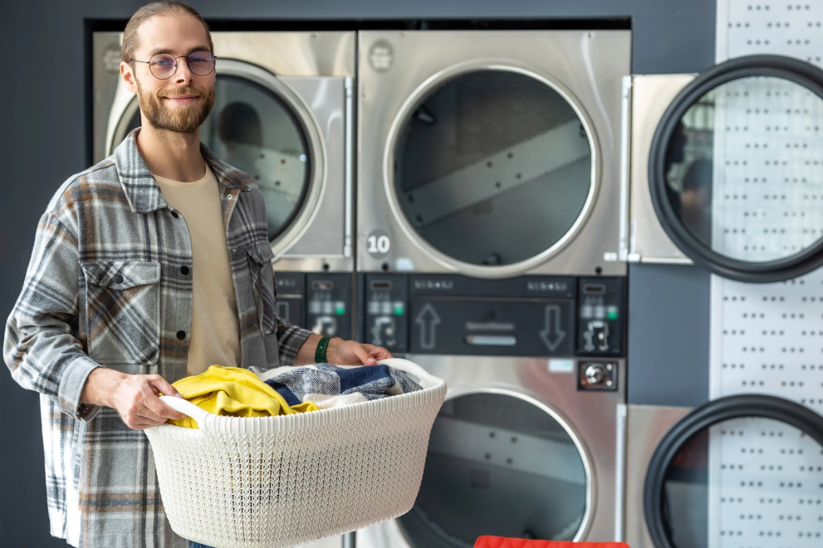 Guy At Laundromat Posing With Basket 1200X800