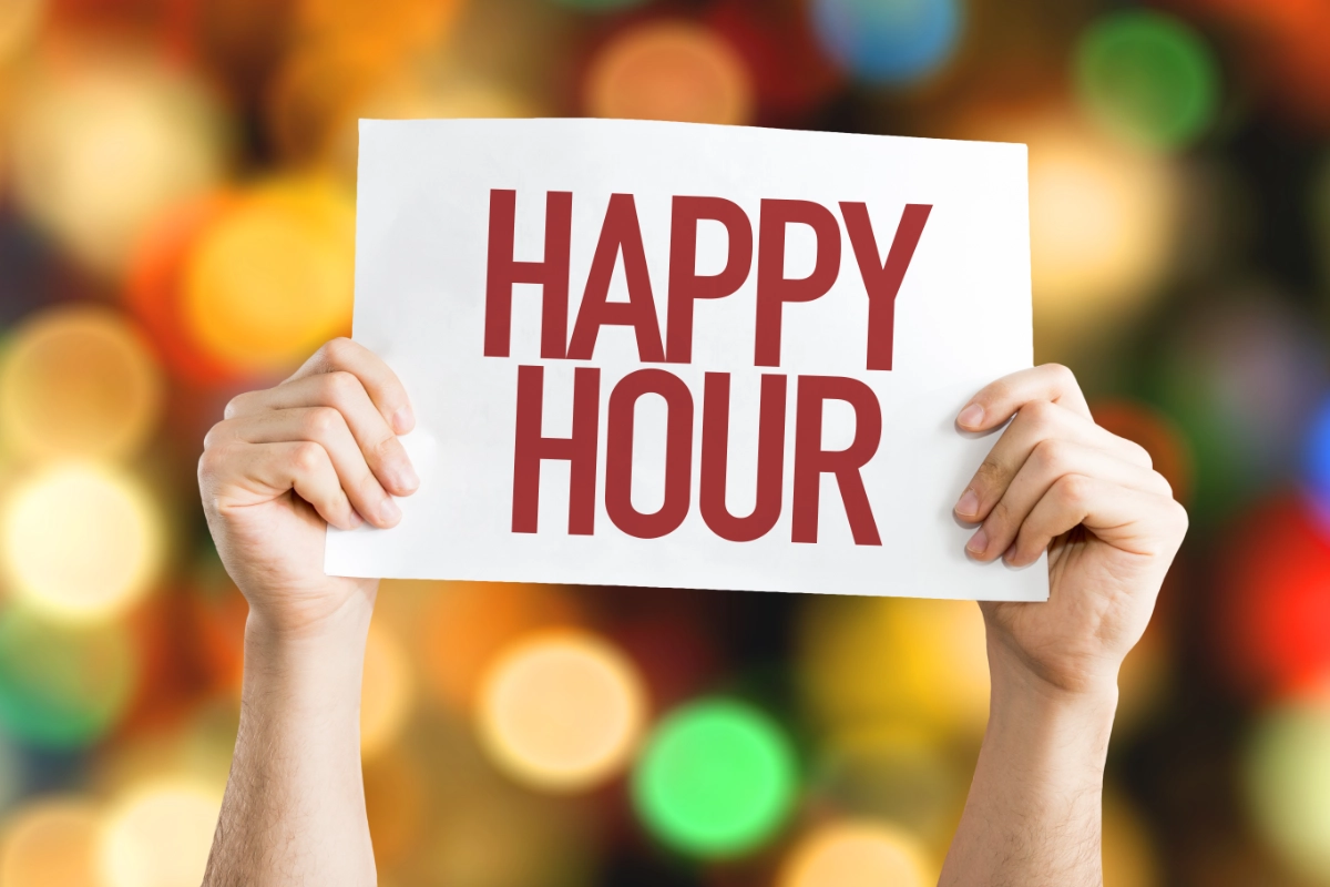 Hands Holding Up Happy Hour Sign 1200X800